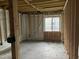 Unfinished basement space with framed walls and a window providing natural light at 2039 Harwinor Se Rd, Smyrna, GA 30082