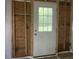 This is a view of a door in an unfinished space with exposed framing at 2039 Harwinor Se Rd, Smyrna, GA 30082