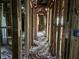 An interior hallway with exposed framing and electrical running the length of it at 2039 Harwinor Se Rd, Smyrna, GA 30082