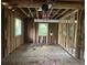 Unfinished interior, framing, exposed wiring, and insulation with lots of natural light at 2039 Harwinor Se Rd, Smyrna, GA 30082