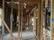 Exposed framing and electrical in a large, unfinished interior area of the home at 2039 Harwinor Se Rd, Smyrna, GA 30082
