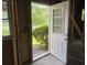 A view through the doorway to the yard in the unfinished room with exposed framing at 2039 Harwinor Se Rd, Smyrna, GA 30082