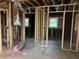 This is an unfinished room with exposed framing, ductwork and windows at 2039 Harwinor Se Rd, Smyrna, GA 30082