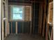 This is an unfinished room with exposed framing, wood studs, and a window at 2039 Harwinor Se Rd, Smyrna, GA 30082