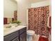 Bathroom with vanity, mirror, toilet, tile floor and decorative shower curtain at 2689 Muskeg Sw Ct, Atlanta, GA 30331