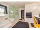 Bathroom features a soaking tub, shower, walk in closet, and vanity with dark cabinets at 2689 Muskeg Sw Ct, Atlanta, GA 30331