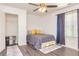 Bedroom with new hard wood floors, closet, and large window at 2689 Muskeg Sw Ct, Atlanta, GA 30331