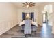 Formal dining room with wainscoting, modern chandelier, and seating for six guests for intimate gatherings at 2689 Muskeg Sw Ct, Atlanta, GA 30331