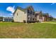 Corner-lot home features an expansive green lawn, with mature landscaping, and attached two-car garage at 2689 Muskeg Sw Ct, Atlanta, GA 30331