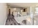 Bright upstairs hallway boasts wood flooring, white railings, and natural lighting at 2689 Muskeg Sw Ct, Atlanta, GA 30331