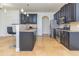 Kitchen with dark cabinets, granite countertops, stainless steel appliances and bar stool seating at 2689 Muskeg Sw Ct, Atlanta, GA 30331