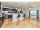 Kitchen with dark cabinets, granite countertops, stainless steel appliances, travertine floors and bar stool seating at 2689 Muskeg Sw Ct, Atlanta, GA 30331