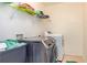 Laundry room with a washer and dryer and a storage shelf at 2689 Muskeg Sw Ct, Atlanta, GA 30331