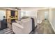 Open living room boasts hard surface flooring, a ceiling fan, and natural light at 2689 Muskeg Sw Ct, Atlanta, GA 30331
