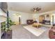 Cozy living room with neutral carpet and paint, fan and views to other rooms for easy entertaining at 2689 Muskeg Sw Ct, Atlanta, GA 30331