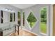 Bright bathroom featuring a glass sink and uniquely framed windows with wooded views at 2755 Whitehurst Ne Dr, Marietta, GA 30062