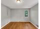 Bedroom featuring hardwood floors, neutral walls, and a window at 2755 Whitehurst Ne Dr, Marietta, GA 30062