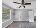 Bedroom with vinyl floors, a ceiling fan, and an open doorway to another room at 2755 Whitehurst Ne Dr, Marietta, GA 30062