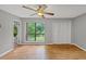 Bright bedroom featuring hardwood floors, large window view, and a double closet at 2755 Whitehurst Ne Dr, Marietta, GA 30062