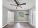 A cozy bedroom featuring gray walls, a window, and a ceiling fan at 2755 Whitehurst Ne Dr, Marietta, GA 30062