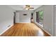 Bedroom with hardwood floors and a large window with view of a deck and greenery at 2755 Whitehurst Ne Dr, Marietta, GA 30062