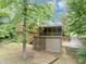 Backyard view of home featuring deck, screened-in porch, and lush green landscaping at 2755 Whitehurst Ne Dr, Marietta, GA 30062