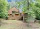 Backyard view of charming two-story home with stairs to deck and screened-in porch at 2755 Whitehurst Ne Dr, Marietta, GA 30062