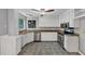 Kitchen with white cabinets, granite countertops, stainless steel appliances, and tile flooring at 2755 Whitehurst Ne Dr, Marietta, GA 30062
