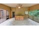 View of screened-in porch with wooded wall, wooden bar, and ceiling fan at 2755 Whitehurst Ne Dr, Marietta, GA 30062