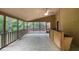 View of screened-in porch with wooden bar, ceiling fan, and door to main house at 2755 Whitehurst Ne Dr, Marietta, GA 30062