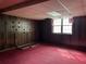 Unfinished basement featuring wood paneling, and a window at 2831 Bettis Ct, Marietta, GA 30066