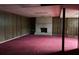 Unfinished basement with wood paneling and a brick fireplace at 2831 Bettis Ct, Marietta, GA 30066
