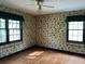 Bedroom with hardwood floors and patterned wallpaper at 2831 Bettis Ct, Marietta, GA 30066