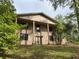 Suburban two-story home featuring a brick facade, large columns, and a well-maintained front lawn at 2831 Bettis Ct, Marietta, GA 30066