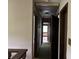 Long hallway with carpet, wood trim and doors, and views to rooms with wallpaper at 2831 Bettis Ct, Marietta, GA 30066