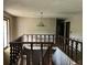 Spacious hallway featuring a decorative chandelier and a staircase with wooden banisters at 2831 Bettis Ct, Marietta, GA 30066