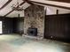 Living room features a stone fireplace, wood paneling, high ceilings, and natural light at 2831 Bettis Ct, Marietta, GA 30066