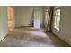 Bedroom featuring bare walls, plywood floors, windows and doorway at 3511 Brookview Dr, Marietta, GA 30068