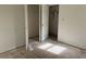 Bedroom with bare floors and open closet space featuring peeling paint, ready for renovation at 3511 Brookview Dr, Marietta, GA 30068