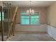 Dining room featuring a chandelier and a large window with exposed framing at 3511 Brookview Dr, Marietta, GA 30068