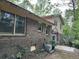 View of the home's exterior featuring brick and siding with large windows at 3511 Brookview Dr, Marietta, GA 30068