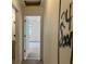 Hallway with open doorway and spray painted wall, presenting a renovation opportunity at 3511 Brookview Dr, Marietta, GA 30068