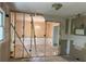 Living room featuring exposed framing and a chandeliered dining room at 3511 Brookview Dr, Marietta, GA 30068