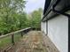 A spacious backyard deck with wooden railing overlooking the greenery and trees at 644 Cambridge Dr, Marietta, GA 30066