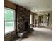 A brick fireplace, in an unfinished living room featuring exposed wall studs, ready for renovation at 644 Cambridge Dr, Marietta, GA 30066