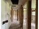 An unfinished hallway with exposed studs and insulation showing the potential for a new design and layout at 644 Cambridge Dr, Marietta, GA 30066