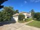 Exterior view of a two story home with a two car garage, and manicured lawn at 311 Arbor Point Sw Ct, Lilburn, GA 30047