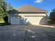 View of the three car garage of this house at 311 Arbor Point Sw Ct, Lilburn, GA 30047