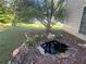 Backyard garden with pond, landscaping, and flower bed at 311 Arbor Point Sw Ct, Lilburn, GA 30047
