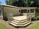 Lovely back deck with steps leading to a screened-in porch, perfect for outdoor entertaining and relaxation at 6512 Executive Dr, Winston, GA 30187